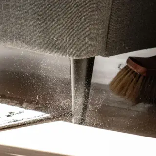 Sweeping a floor, and pushing a ton of dust up into the air.